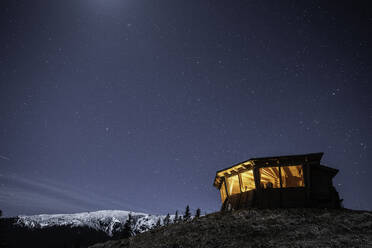 Comisu Wildlife Hide at night, Fagaras Mountains, Arges County, Muntenia, Romania, Europe - RHPLF31675