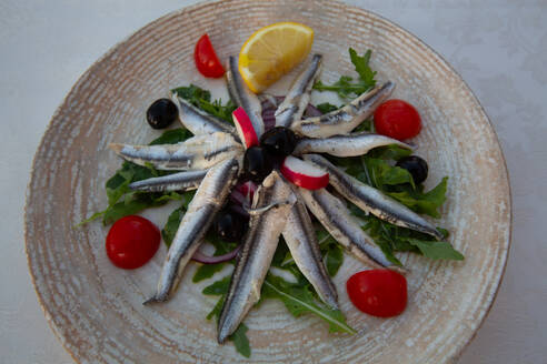 Food dish of Marinated Anchovies with Cherry Tomatoes and Olives, Restaurant, Old Town, Novigrad, Croatia, Europe - RHPLF31795