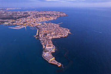 Aerial shot of Syracuse and the old city on the island of Ortigia at dawn, UNESCO World Heritage Site, Syracuse province, Ioanian sea, Sicily, Italy, Mediterranean, Europe - RHPLF31934