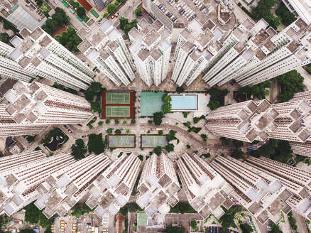 Swimming pool with sports courts near tall buildings - MMPF01201