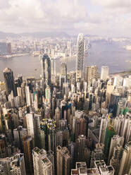 Hong Kong city in front of sea with famous buildings under cloudy sky - MMPF01207