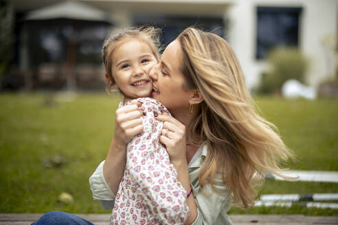 Happy mother embracing cute daughter - JOSEF23190