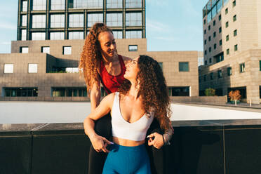 Lgbt couple training together outdoor. Runner real couple making sport in an urban area of the city. Concepts of sports and lifestyle - DMDF09873