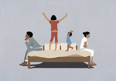 Kids playing, jumping on bed between frustrated parents sitting back to back - FSIF06975