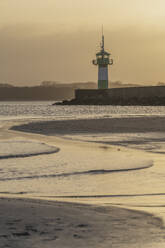 Germany, Schleswig-Holstein, Lubeck, Travemunde lighthouse at dawn - KEBF02831