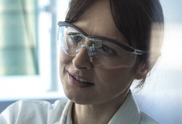 Scientist working on DNA sequencing data in laboratory - ABRF01145