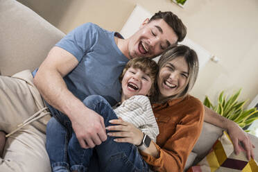 Cheerful family enjoying at home - UUF31382