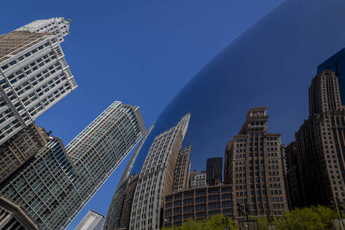 USA, Illinois, Chicago, Cloud Gate sculpture reflecting surrounding skyscrapers - NGF00839