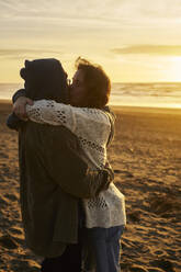 Loving couple kissing at beach - ANNF00949