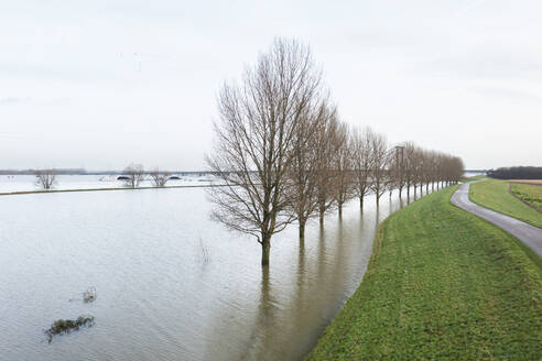 Netherlands, Aerial view of river Waal flooding surrounding land after prolonged rainfall - MKJF00042