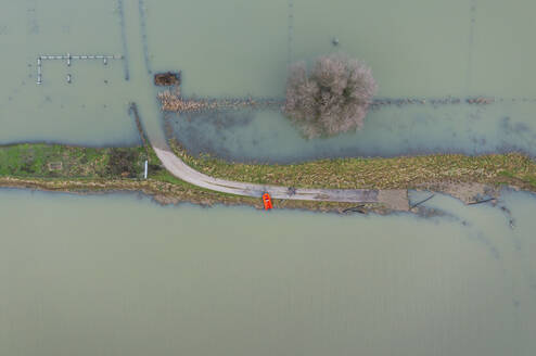 Netherlands, Aerial view of river Waal flooding surrounding land after prolonged rainfall - MKJF00047