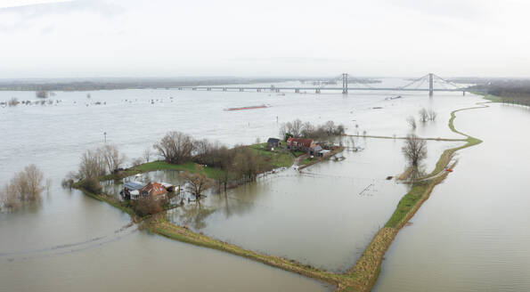 Netherlands, Aerial view of river Waal flooding surrounding land after prolonged rainfall - MKJF00050