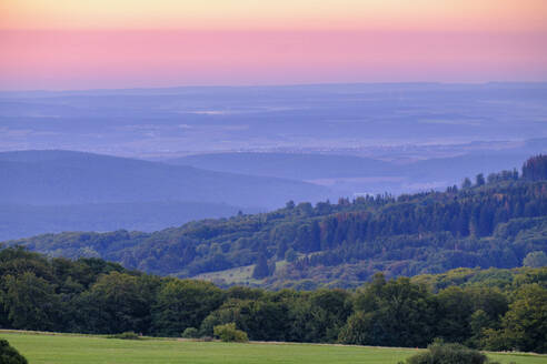 Germany, Bavaria, Forested hills along High Rhon Road at dawn - LBF03887
