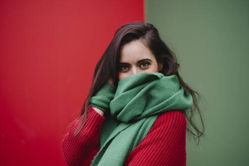 Woman covering face with green scarf - AMWF02066