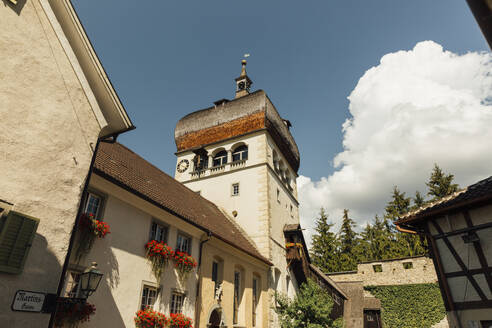 Austria, Vorarlberg, Bregenz, Martinsturm tower with summer clouds in background - AIF00792