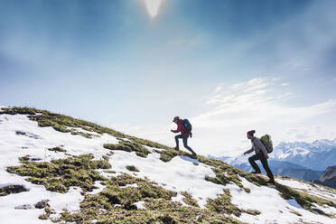 Hiker couple moving up on mountain at Bavarian Alps in Germany - UUF31469