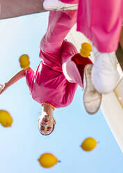 Woman standing over mirror under blue sky - EGHF00844