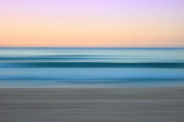 Softly blurred lines of a coastal seascape at dawn with delicate pink and blue hues over the Mediterranean - ADSF53124