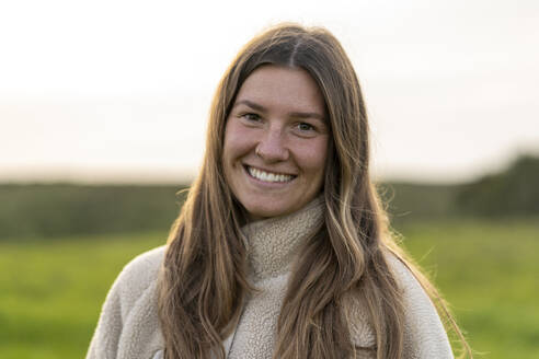 Smiling young woman in nature - JSIF00001