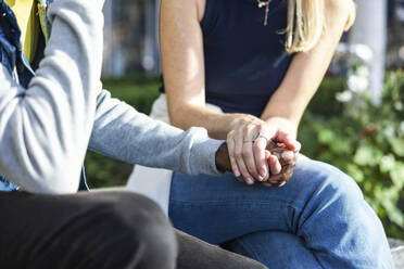 Young woman consoling friend in city - WPEF08487