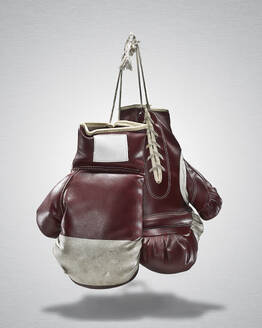 Studio shot of pair of old boxing gloves - TETF02583