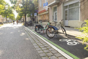 Electric bikes at bicycle parking station in city - MAMF02955