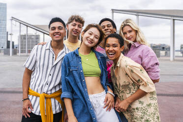 Group photo of happy young friends with colorful clothing smiling at camera - OIPF04036