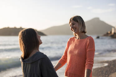 Cheerful friends spending leisure time together at beach - JOSEF23660