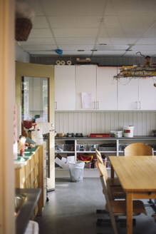 Empty activity room with chair and table at preschool - MASF43053