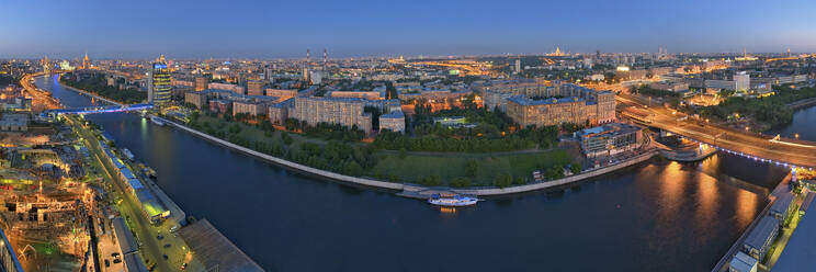 Aerial panoramic view of Moscow downtown at night along the Moskva river, Moscow, Russia. - AAEF26038