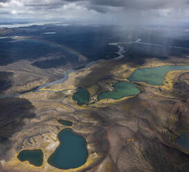 Aerial view of a river crossing the valley at sunset with lakes and volcanic landscape, Highlands, Iceland. - AAEF26047