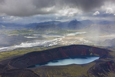 Aerial view of a crater lake and river estuary in the highland region of Iceland. - AAEF26048