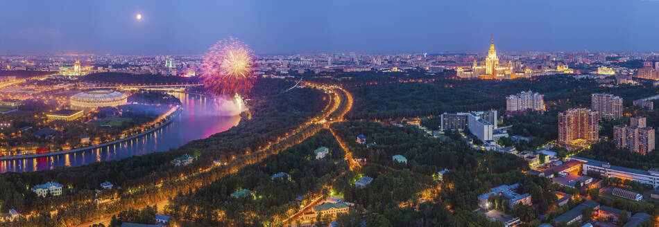 Aerial panoramic view of fireworks along the Moskva River at sunset in Moscow downtown, Moscow Oblast, Russia. - AAEF26098