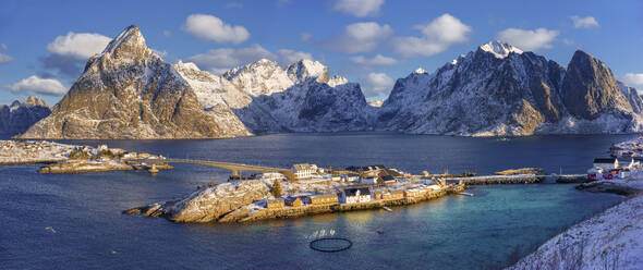 Aerial view of small fishing villages along the fjords coastline in winter, Lofoten Islands, Norway. - AAEF26121