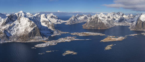 Aerial view of small fishing villages along the fjords coastline in winter, Lofoten Islands, Norway. - AAEF26122