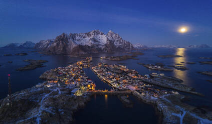 Aerial view of Henningsvaer in winter at sunset, a small town on the Lofoten Islands archipelagos, Norway. - AAEF26132