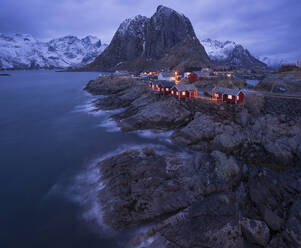 Aerial view of Henningsvaer in winter at sunset, a small town on the Lofoten Islands archipelagos, Norway. - AAEF26133