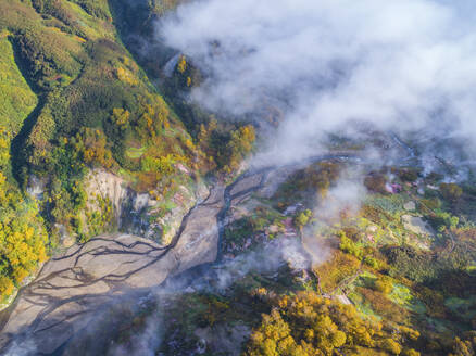 Aerial view of Dolina Geyzerov, a volcanic caldera and geothermal area with hot spring water in Valley of Geysers, Kamchatka Krai peninsula, Russia. - AAEF26152