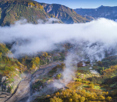 Aerial view of Dolina Geyzerov, a volcanic caldera and geothermal area with hot spring water in Valley of Geysers, Kamchatka Krai peninsula, Russia. - AAEF26153