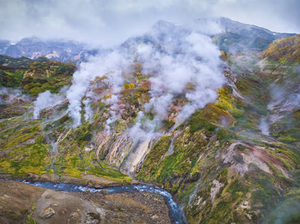 Aerial view of Dolina Geyzerov, a volcanic caldera and geothermal area with hot spring water in Valley of Geysers, Kamchatka Krai peninsula, Russia. - AAEF26156