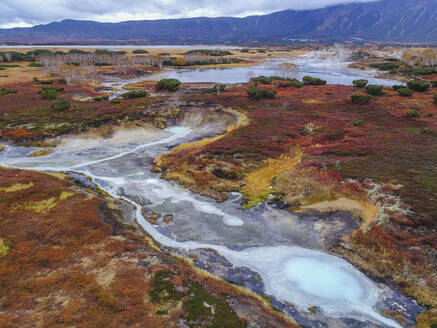 Aerial view of Uzon, a volcanic caldera and geothermal area with hot spring water in Kamchatka Krai peninsula, Russia. - AAEF26158