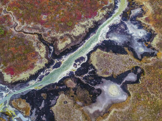 Aerial view of Uzon, a volcanic caldera and geothermal area with hot spring water in Kamchatka Krai peninsula, Russia. - AAEF26160