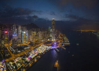 Aerial view of Hong Kong skyline with financial district at night along Kowloon Bay, Hong Kong, China. - AAEF26182