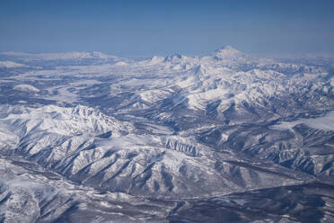 Aerial view of mountain landscape in winter with snow in the Kamchatka Krai region, Russia. - AAEF26192