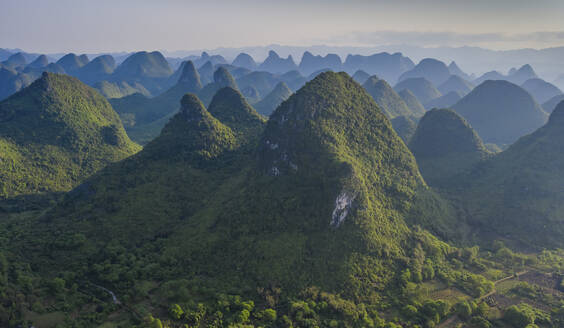 Aerial view of Moon Hill Yangshuo, a scenic hilly landscape, Yangshuo County, Guilin, Guangxi Zhuang Autonomous Region, China. - AAEF26199