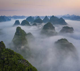 Aerial view of Moon Hill Yangshuo, a scenic hilly landscape, Yangshuo County, Guilin, Guangxi Zhuang Autonomous Region, China. - AAEF26202