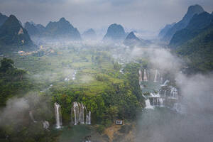 Aerial view of Detian Transnational Waterfalls along the river at Moon Hill Yangshuo valley, Chongzuo City, Yangshuo County, Guilin, Guangxi Zhuang Autonomous Region, China. - AAEF26207