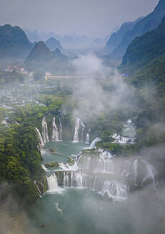 Aerial view of Detian Transnational Waterfalls along the river at Moon Hill Yangshuo valley, Chongzuo City, Yangshuo County, Guilin, Guangxi Zhuang Autonomous Region, China. - AAEF26208