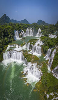 Aerial view of Detian Transnational Waterfalls along the river at Moon Hill Yangshuo valley, Chongzuo City, Yangshuo County, Guilin, Guangxi Zhuang Autonomous Region, China. - AAEF26210