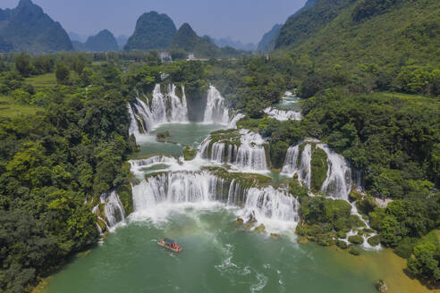 Aerial view of Detian Transnational Waterfalls along the river at Moon Hill Yangshuo valley, Chongzuo City, Yangshuo County, Guilin, Guangxi Zhuang Autonomous Region, China. - AAEF26213